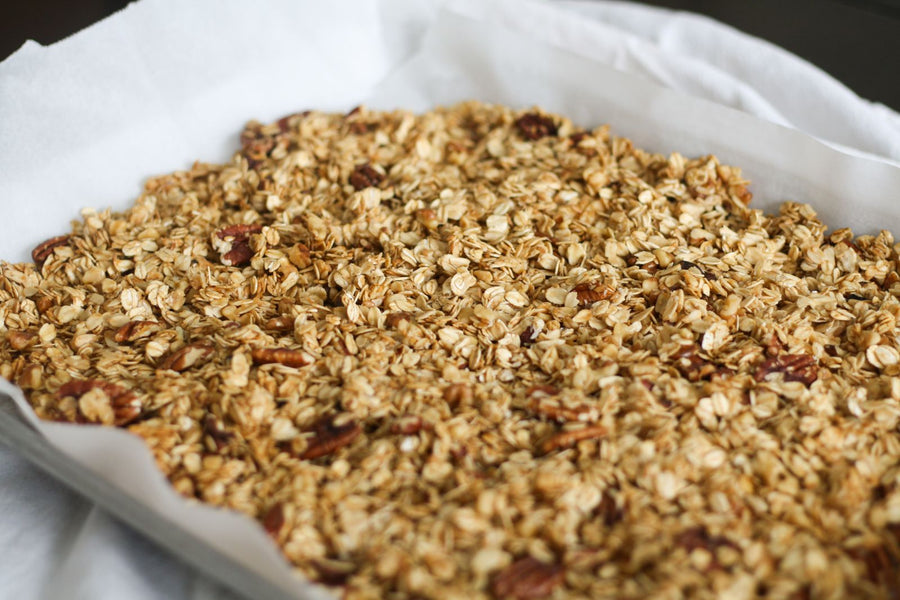 Maple pecan granola on a baking sheet