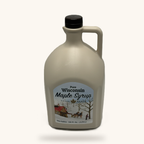 One gallon plastic jug of Skarda Maple Farms pure maple syrup